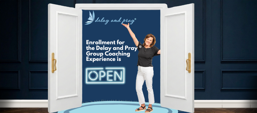 Beth sitting at table working on computer